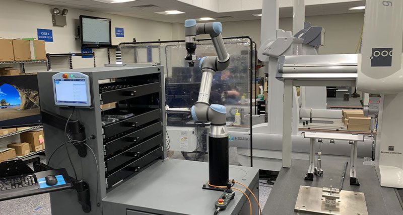 Sistema de carga y descarga de piezas para la máquina TEMPO CMM Sistema de carga y descarga de piezas para la máquina TEMPO CMM